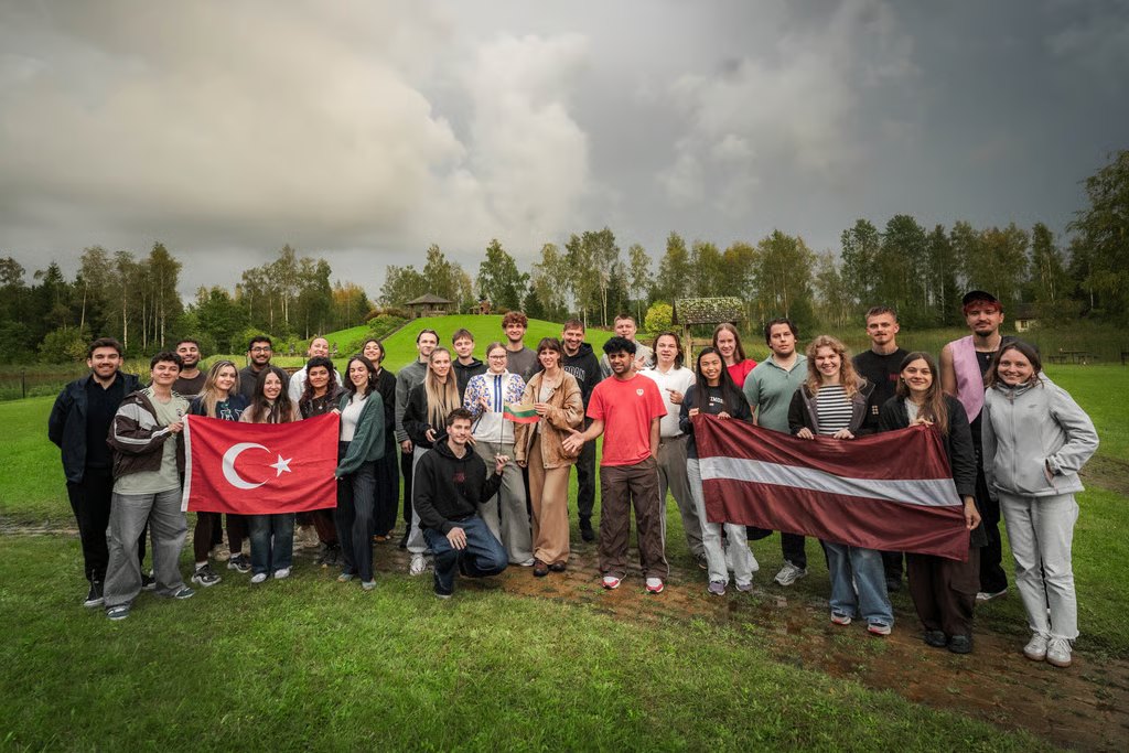 Participants from Türkiye, Latvia and Lithuania with their flags in Limbaži, Latvia